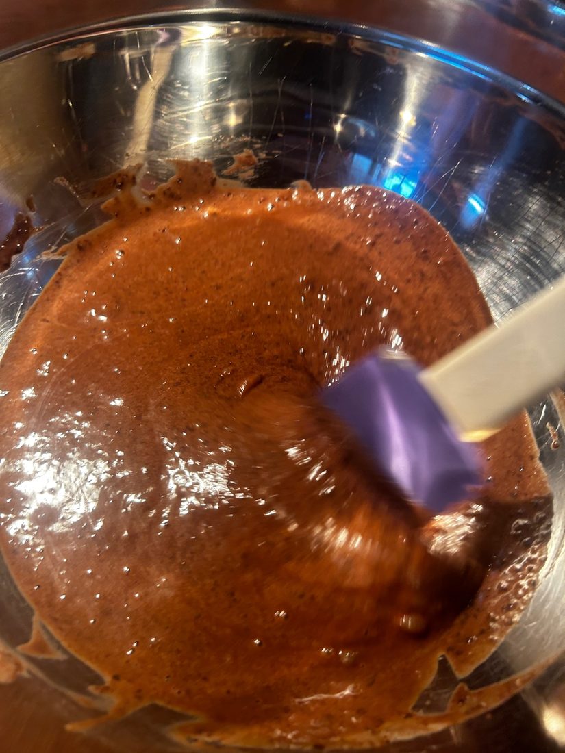 Finished glossy chocolate batter being stirred