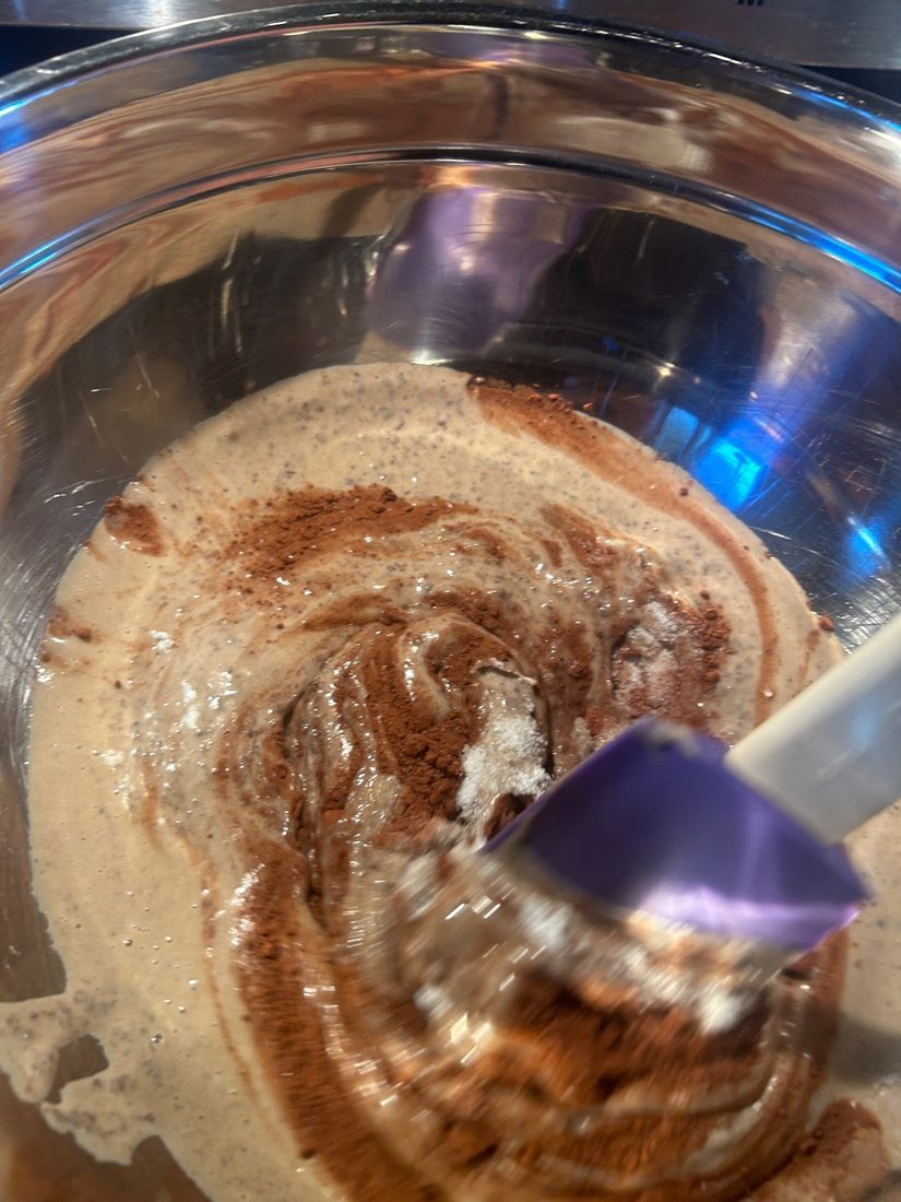 Folding cocoa into the bean puree